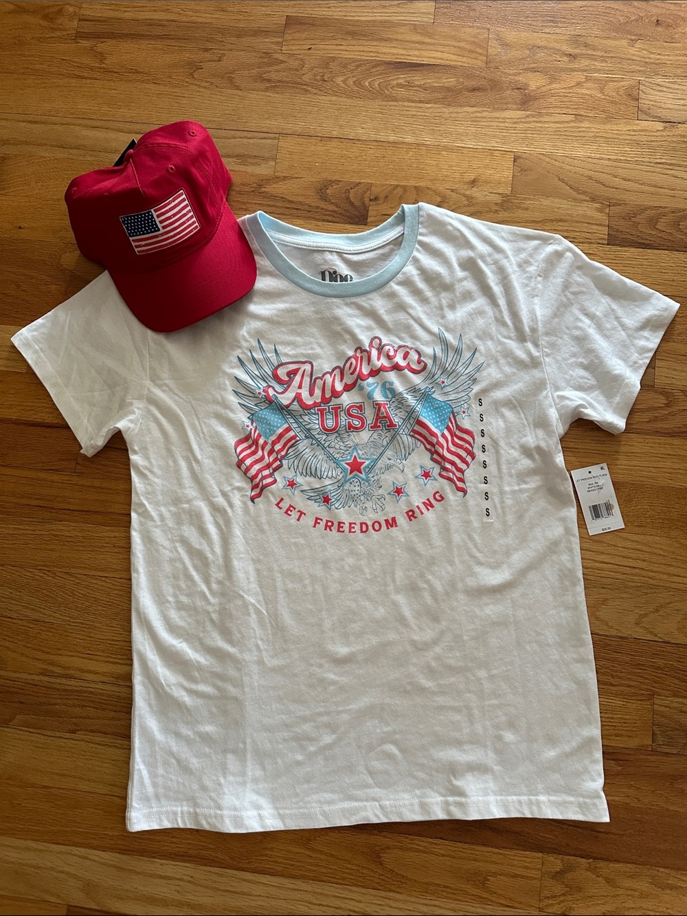 White Graphic Tee - (light blue trim)
And red cap with flag